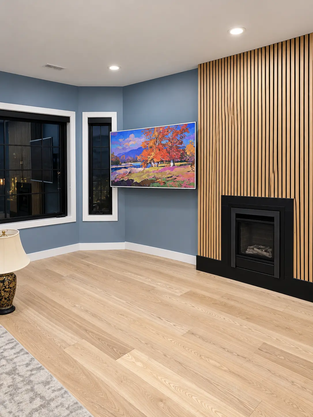 Living room with oak-slat fireplace feature wall, oak flooring and mounted television