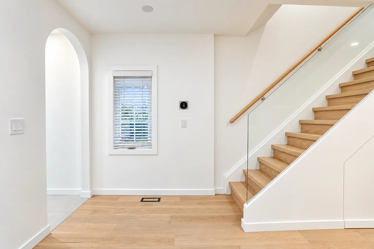 Redesigned oak staircase with frameless glass railing
