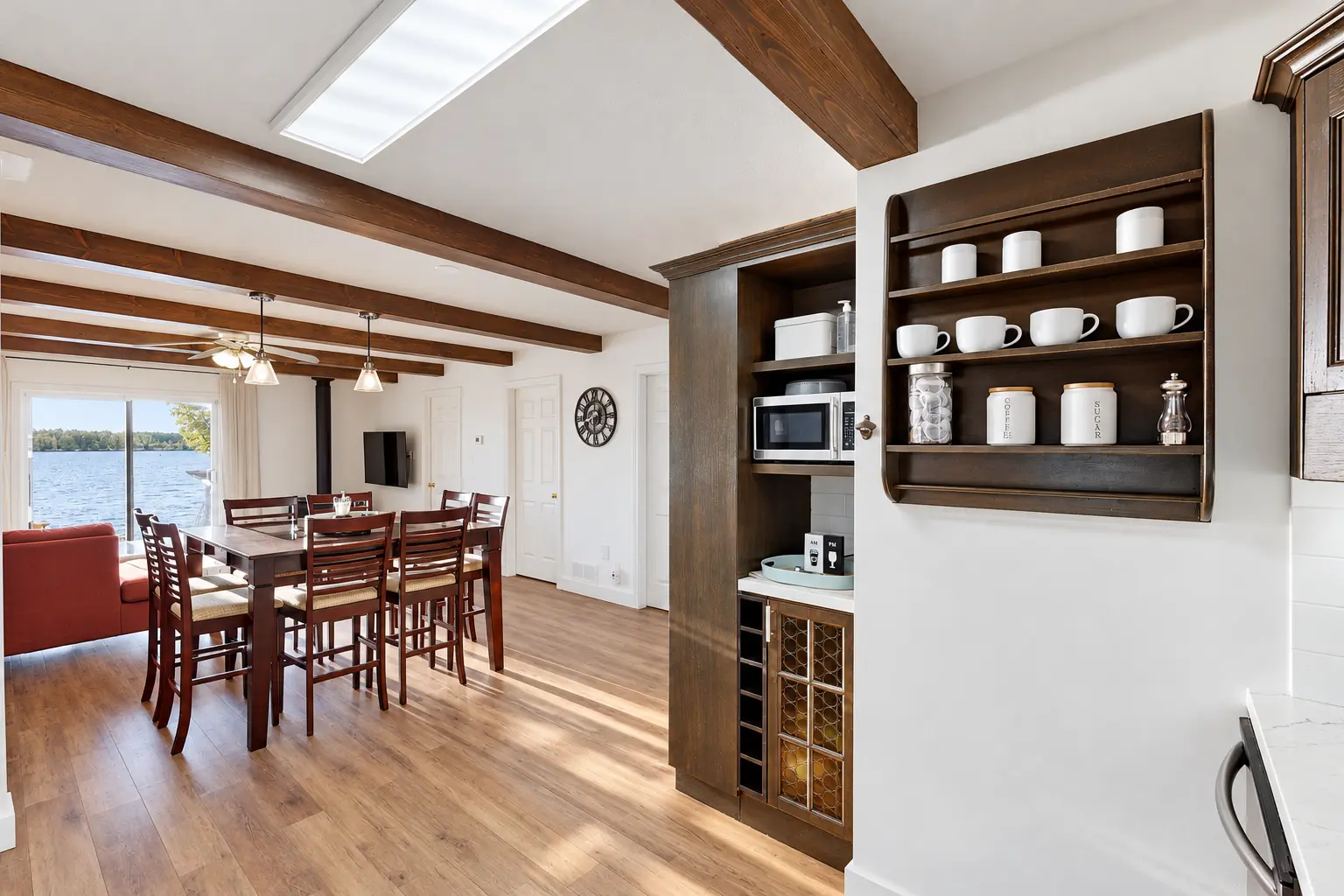 Refinished cottage kitchen and dining area with installed wood ceiling beams