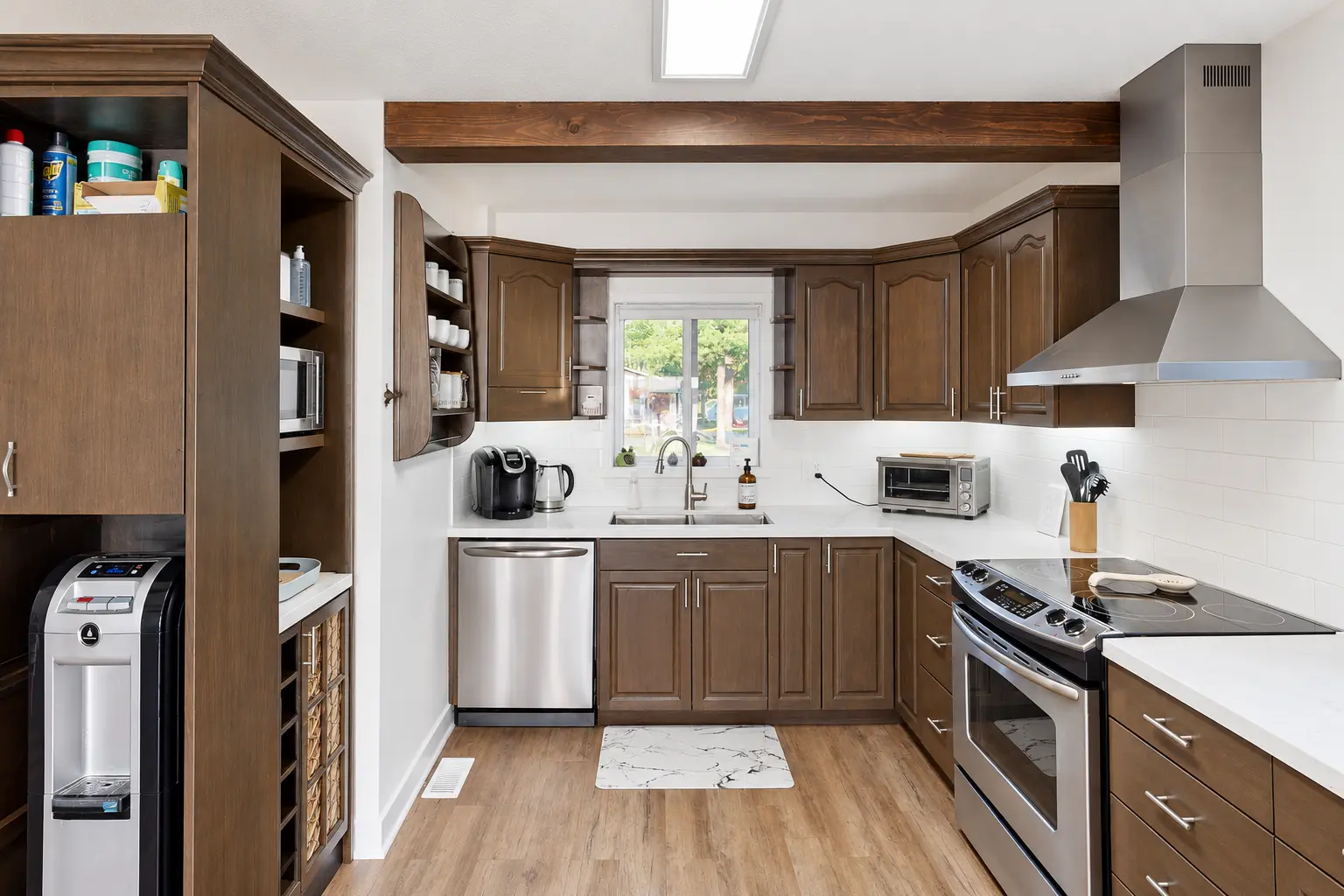 Refinished cottage kitchen cabinets with updated interior finishes